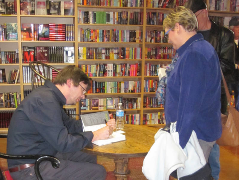 Ian Rankin signing a book