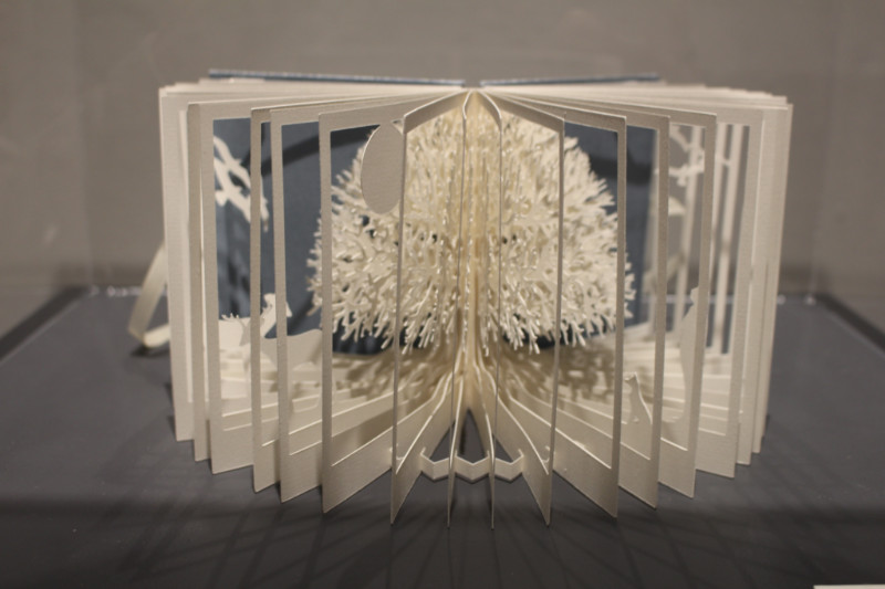 Artist's book by Mary Conley with three-dimensional tree cut into it 