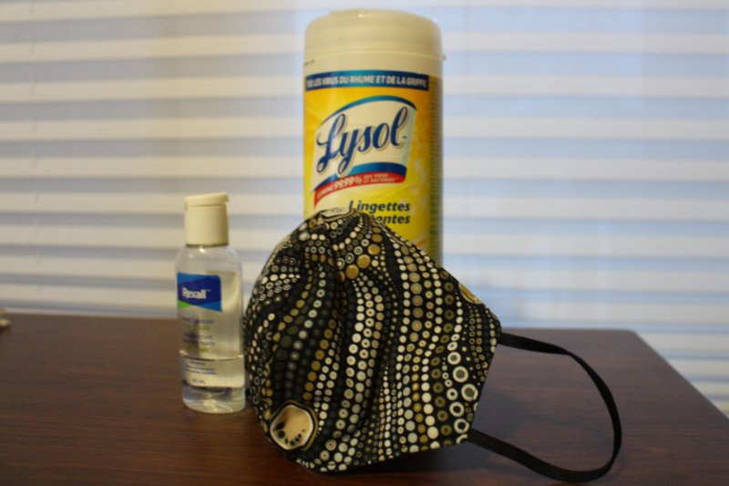 Sanitizing wipes, hand sanitizer, and a face mask - pandemic supplies