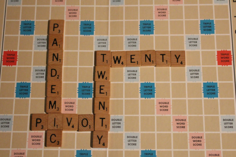 Scrabble board with words twenty, pandemic, and pivot