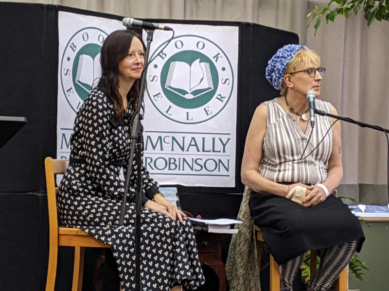 Author Nancy Chislett and book launch host Laura Rae on chairs in front of the audience