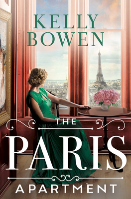 Cover of The Paris Apartment shows a woman in a green dress sitting in front of a two-paned window with the view of the Eiffel Tower and the city
